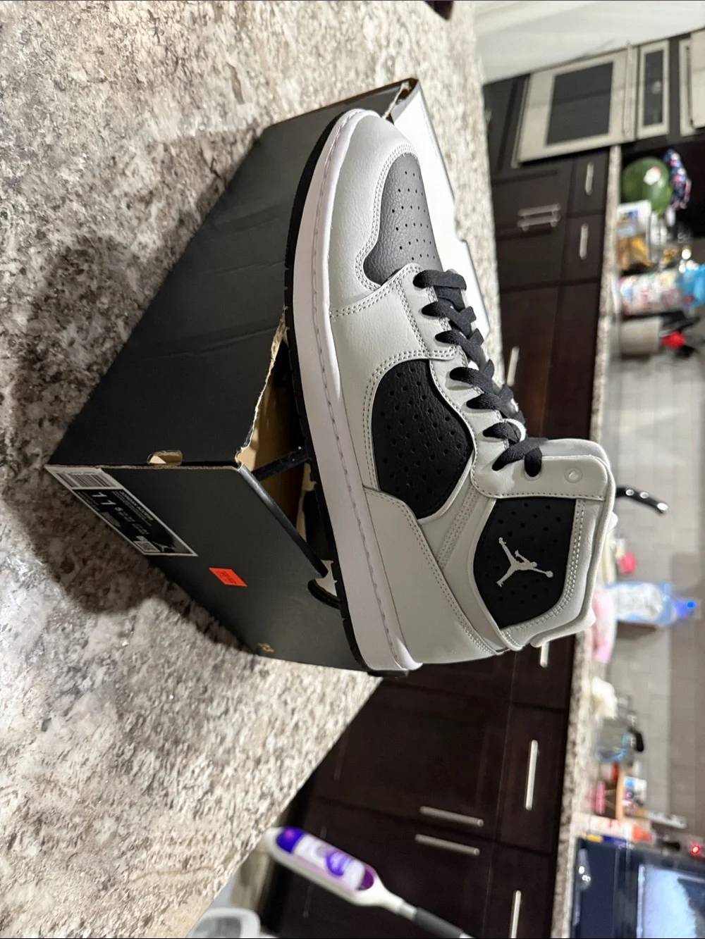 Jordan Black and White Mid-Top Basketball Sneakers